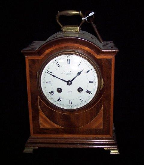 Appraisal: An Edwardian mahogany mantel clock the arch top case banded