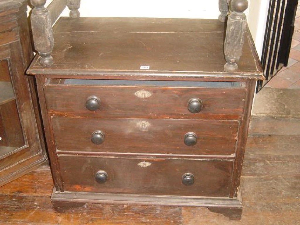 Appraisal: A small Georgian stained pine chest fitted with -long graduated