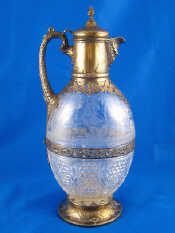 Appraisal: A Victorian silver mounted cut and engraved glass claret jug