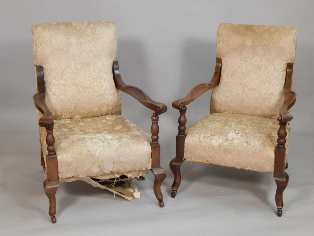 Appraisal: A pair of Continental walnut open armchairs with a padded