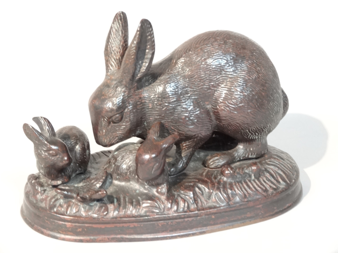 Appraisal: A thC bronzed figure group of rabbits on a naturalistic