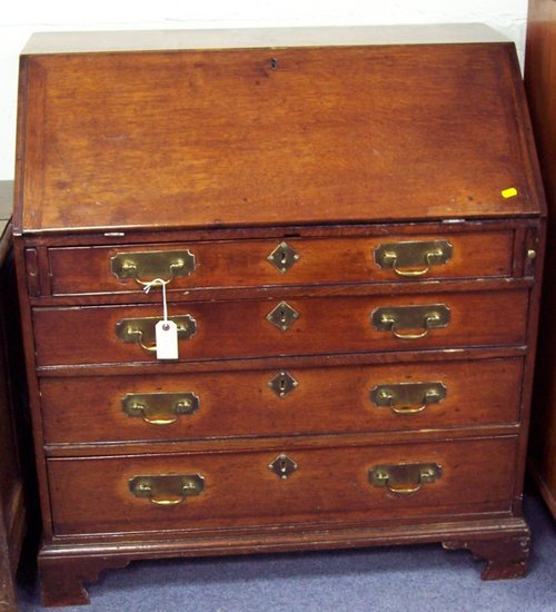 Appraisal: A late th early th Century oak bureau fitted beneath