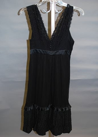 Appraisal: Black Silk with lace shoulder straps bodice fabric buttons and