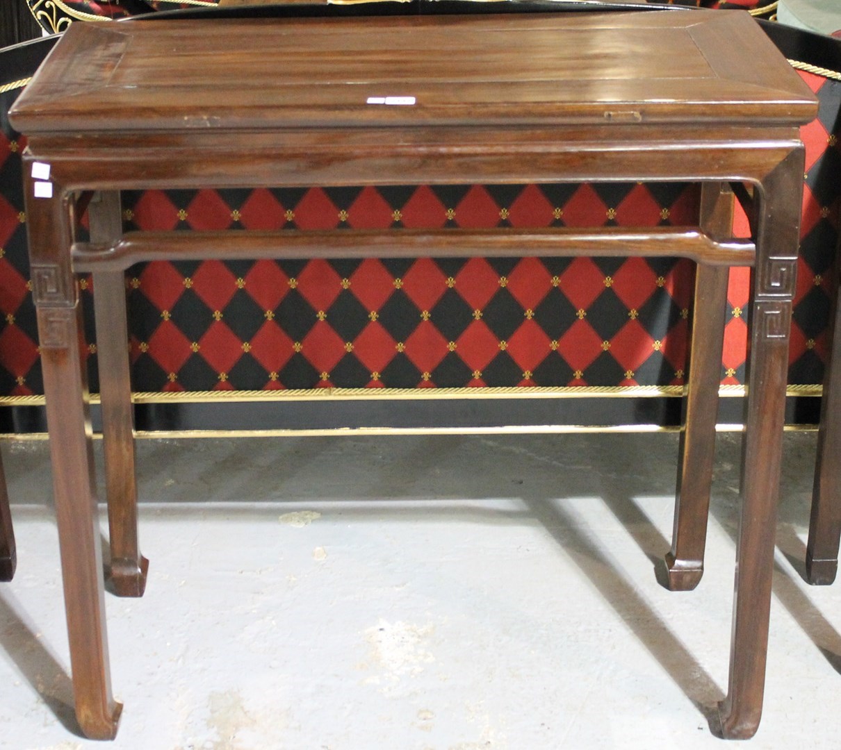 Appraisal: A late th century Chinese hardwood altar table on block