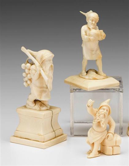 Appraisal: Group of three carved ivory figures of gnomes late th