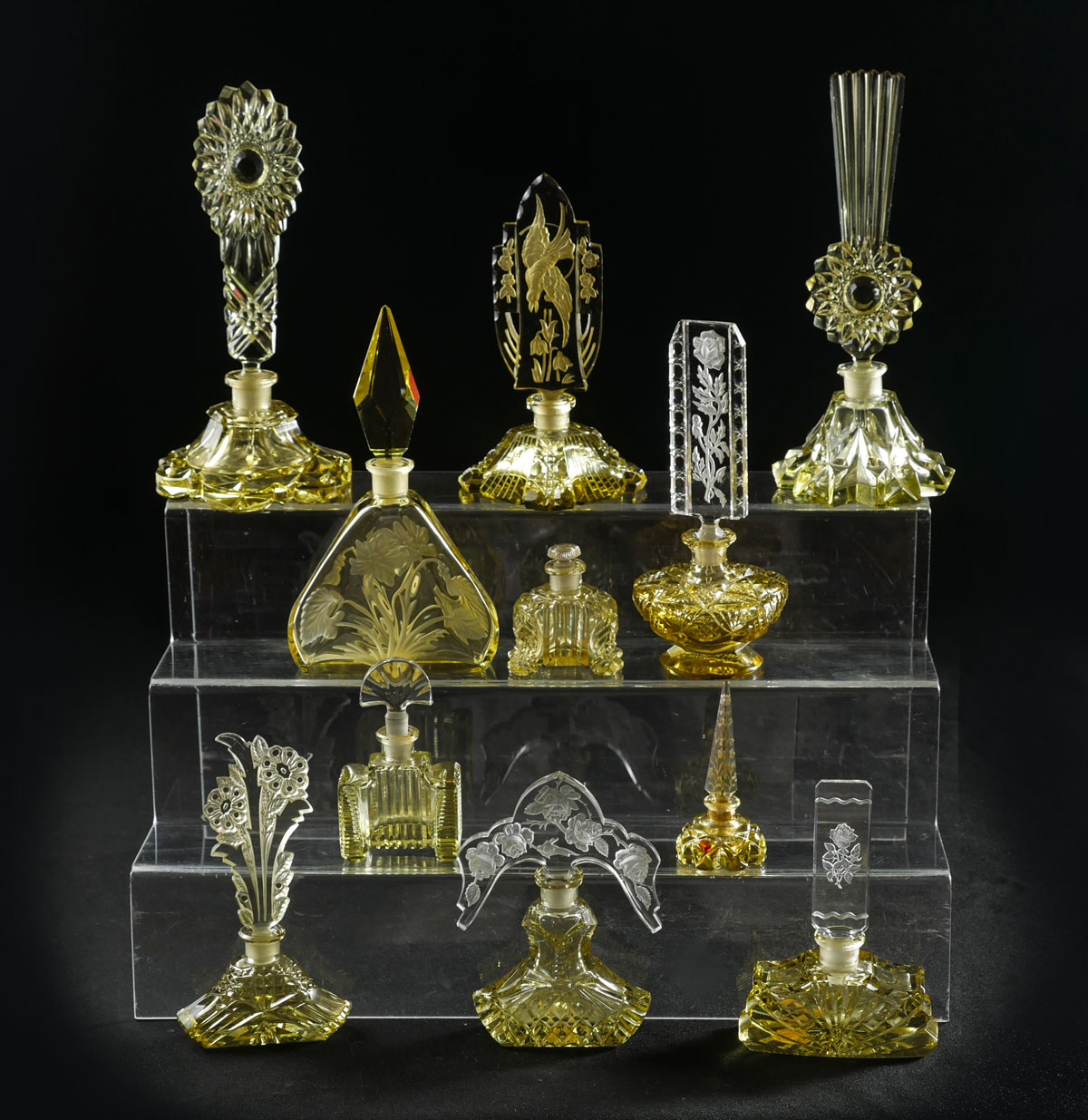 Appraisal: ART DECO PERFUME BOTTLE COLLECTION Comprising Czech Bohemian yellow clear