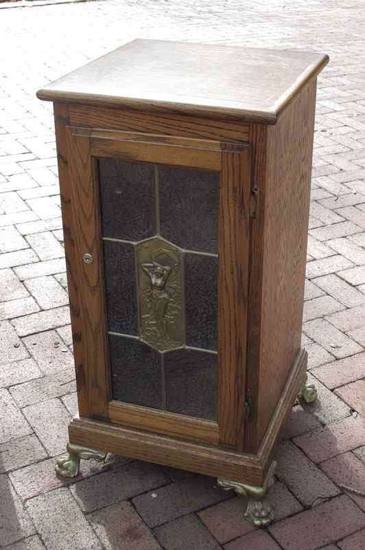 Appraisal: ART NOUVEAU STYLE OAK SLOT MACHINE STAND Oak case with