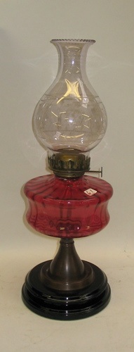 Appraisal: AN ENGLISH CRANBERRY GLASS OIL LAMP the cranberry font fitted