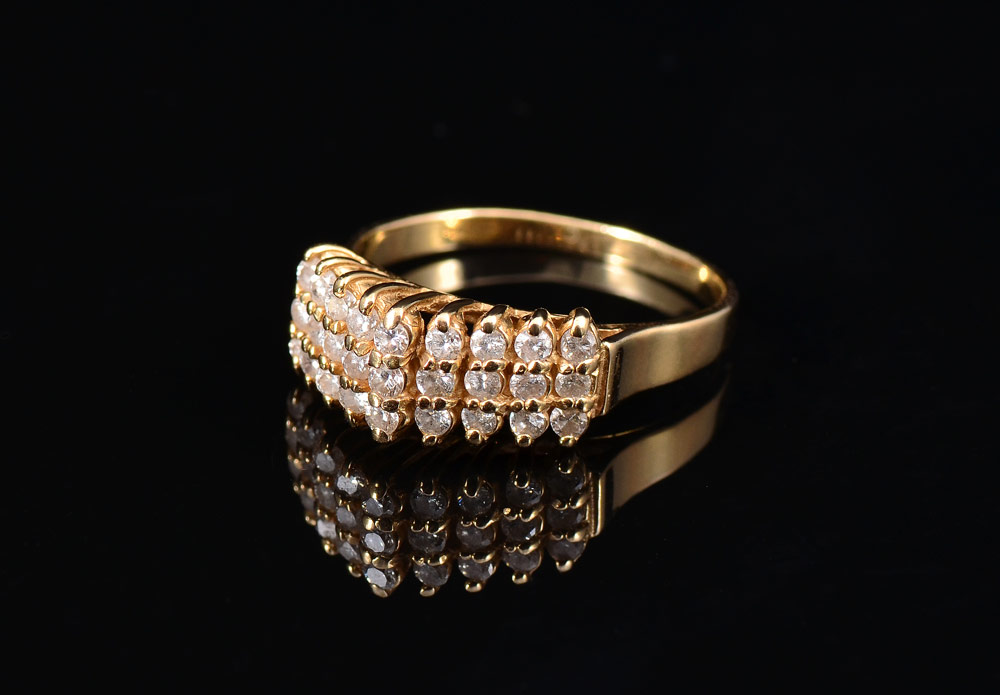 Appraisal: HIGH PROFILE DIAMOND RING K yellow gold ring contains round