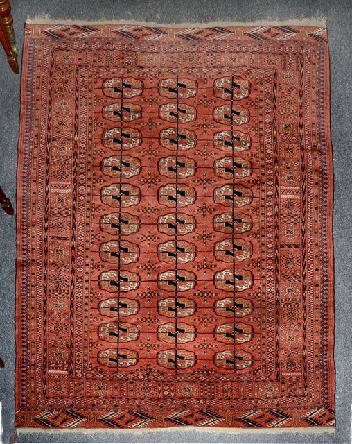 Appraisal: A TEKKE RED GROUND RUG decorated three rows of gulls