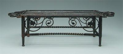 Appraisal: Iron trivet spiral and floral decoration flanking gridiron top x