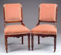 Appraisal: PAIR OF UPHOLSTERED WALNUT VICTORIAN SIDE CHAIRS Turned legs with