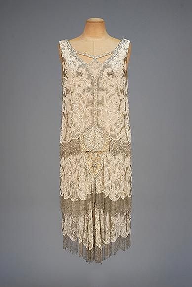 Appraisal: BEADED and FRINGED FLAPPER DRESS s Sleeveless cream silk chiffon