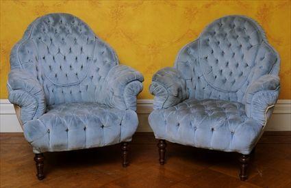 Appraisal: PAIR OF MID-VICTORIAN WALNUT ARMCHAIRS WITH DEEP-BUTTONED AND PLEATED VELVET