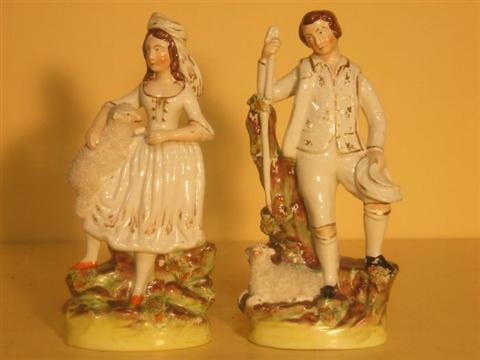 Appraisal: PAIR OF STAFFORDSHIRE FIGURES Late th early th century of