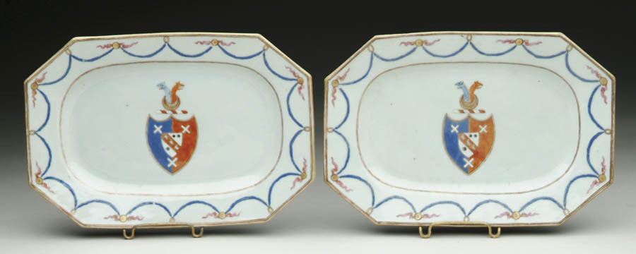 Appraisal: PAIR OF CHINESE EXPORT FAMILLE-ROSE ARMORIAL CHAMFERED RECTANGULAR SMALL PLATTERS