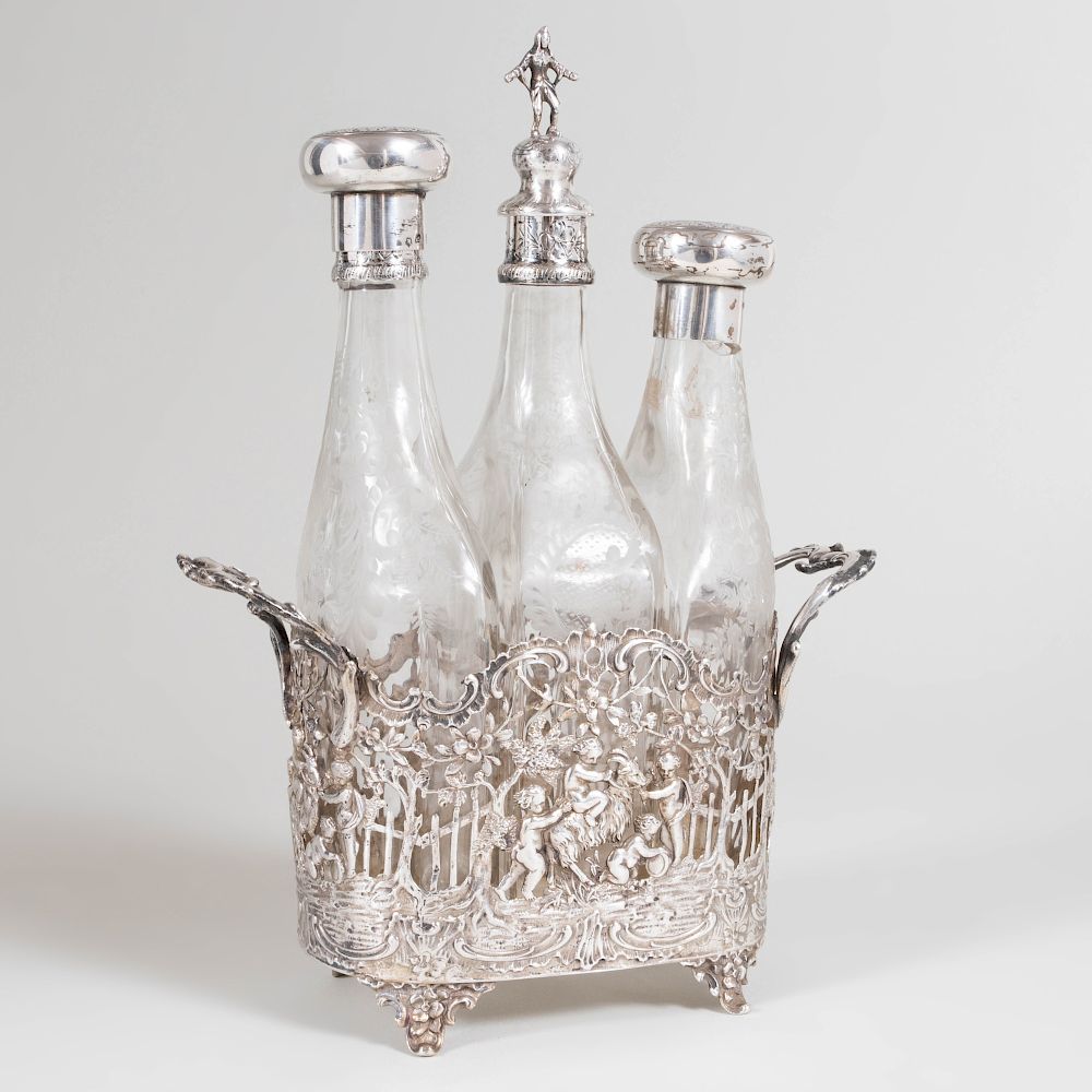 Appraisal: Continental Silver Cruet Frame Fitted with Three Etched Glass Bottles