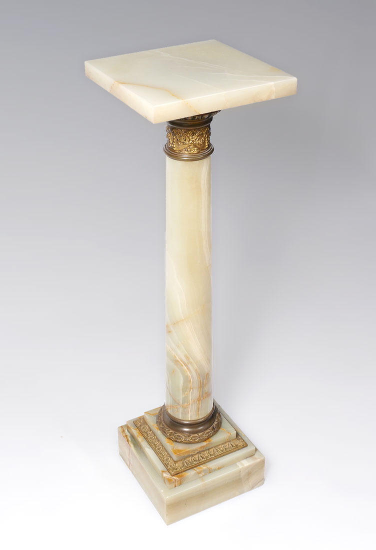 Appraisal: BRONZE ONYX PEDESTAL Rotating onyx top over gilt bronze collars