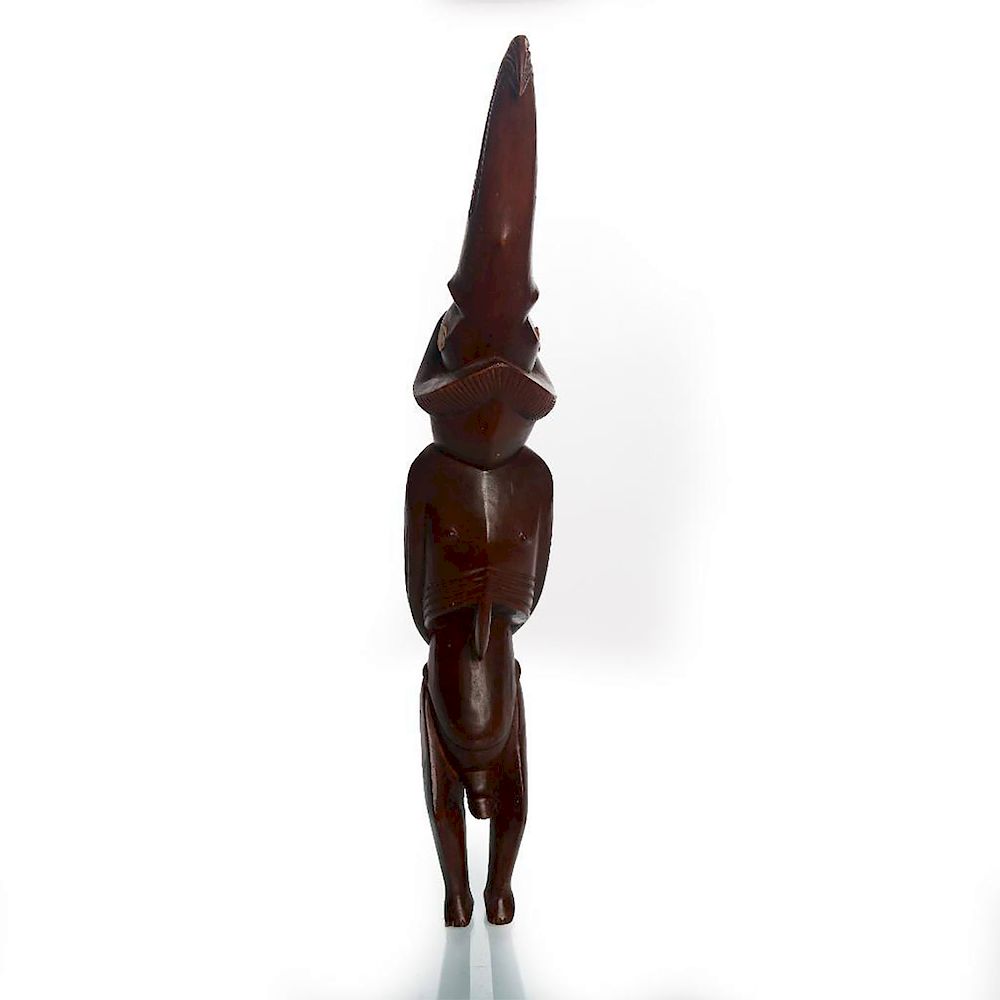 Appraisal: ALL WOODEN AFRICAN TRIBAL SCULPTURE MAN WITH BIRD HEAD Hand