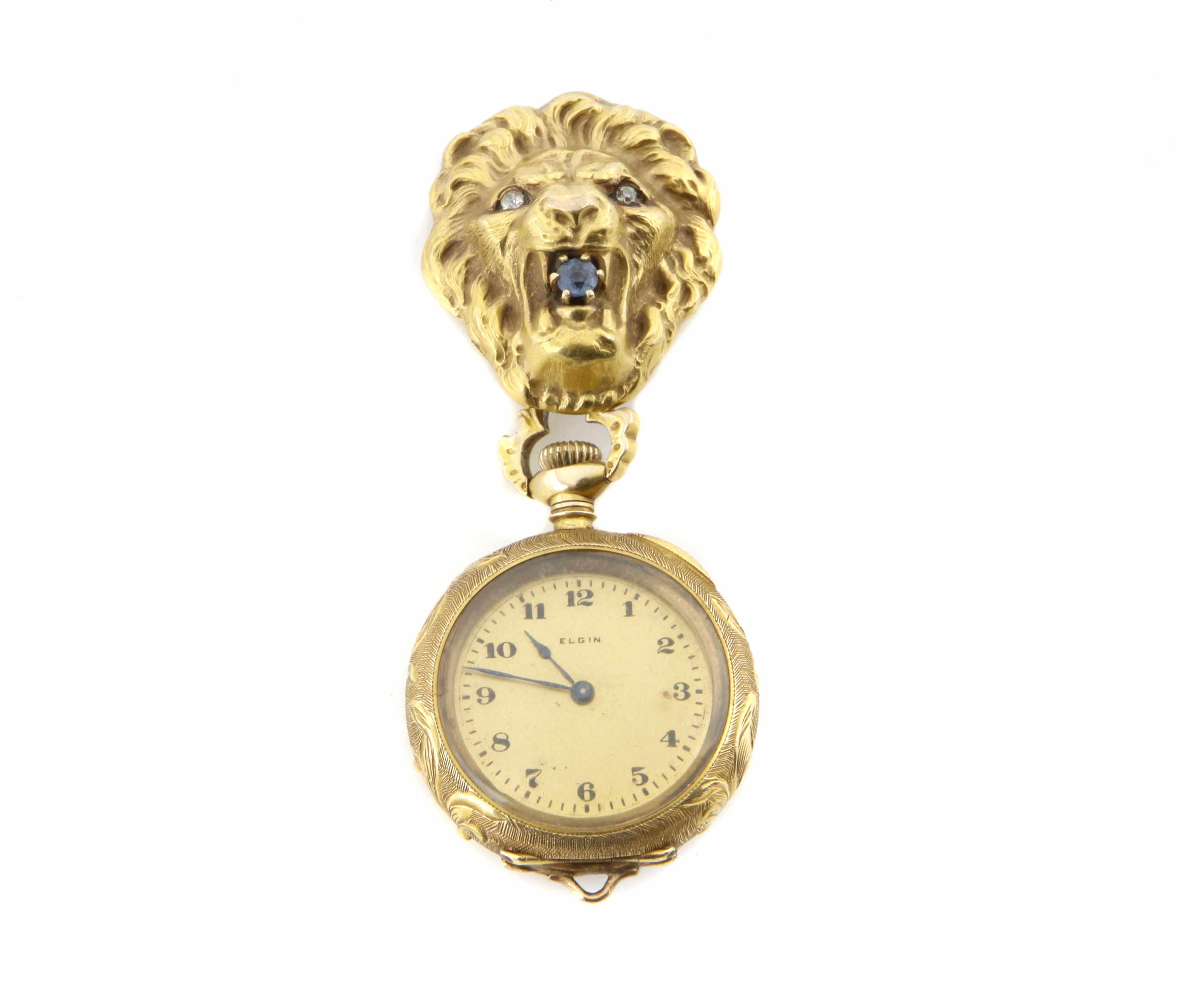 Appraisal: A gem-set diamond and gold ''lion's head'' pendant-brooch-watch dial signed