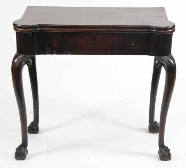 Appraisal: A George III mahogany tea table the folding top with