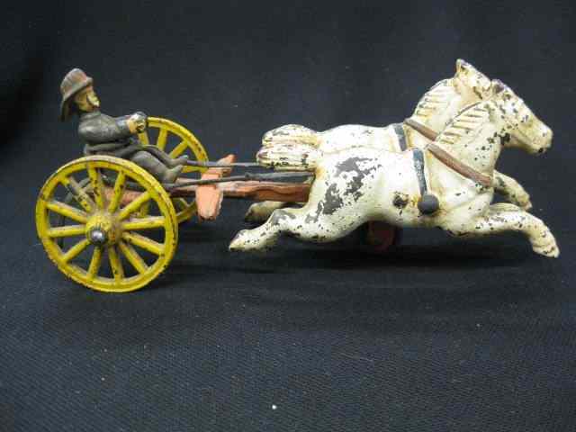 Appraisal: Antique Cast Iron Toy of Horses driver adapted lacking firewagon