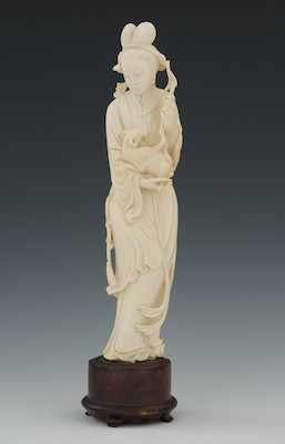 Appraisal: A Carved Ivory Attendant Holding a Small Goat Standing figure