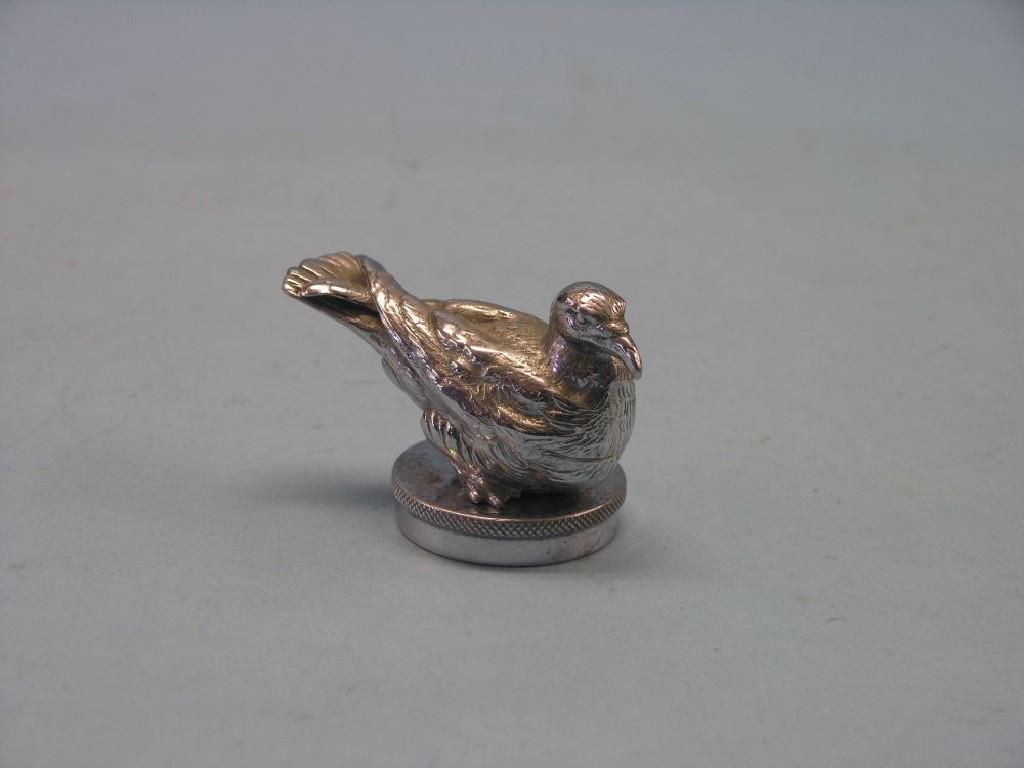 Appraisal: A chromium car mascot in the form of a perched