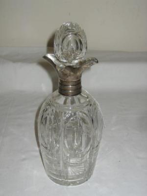 Appraisal: A CUT GLASS DECANTER the ovoid body cut with ovals