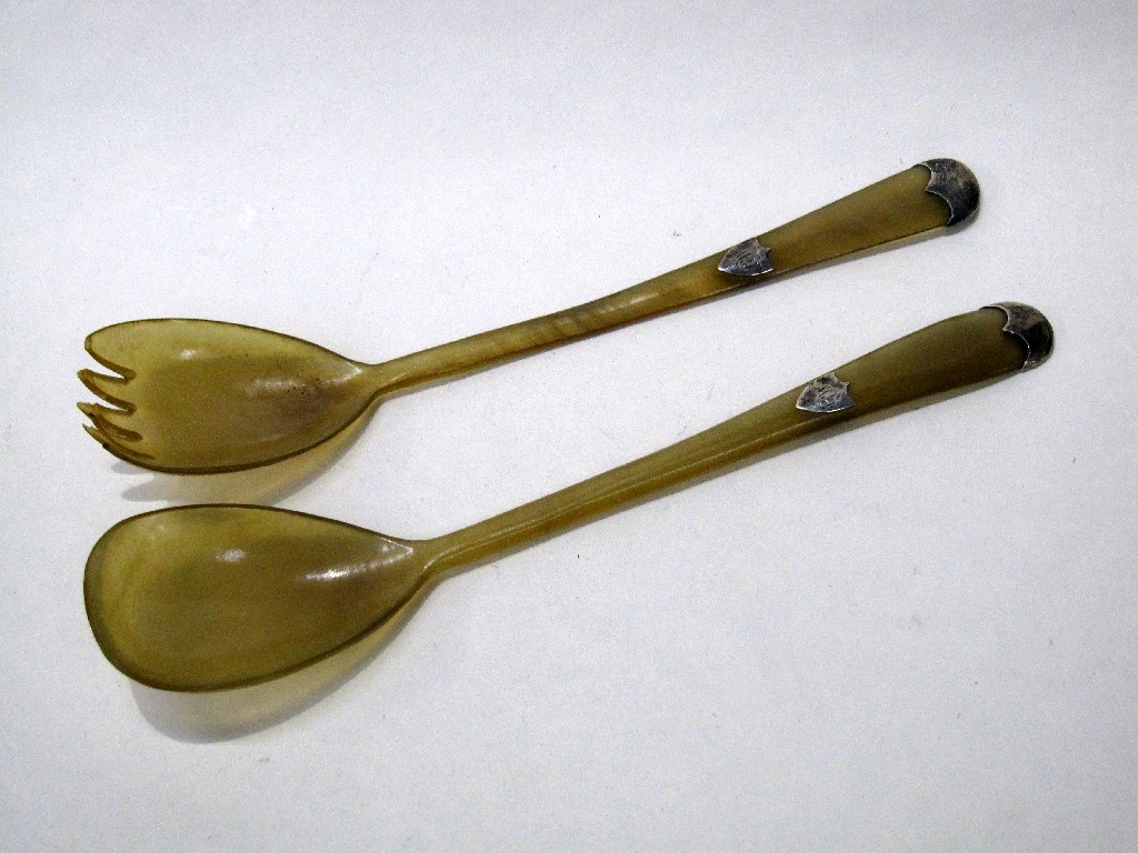 Appraisal: Pair of silver mounted bone serving spoons