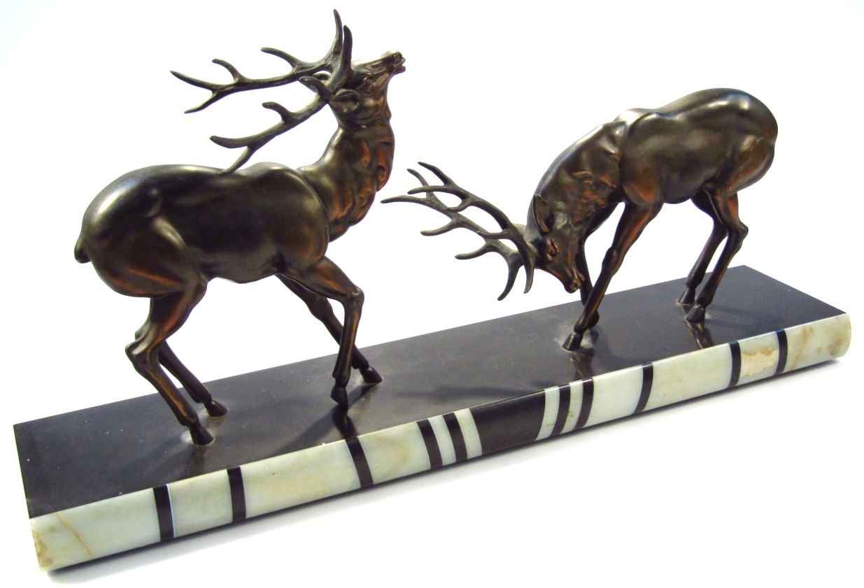 Appraisal: An Art Deco spelter and marbled figure group of rutting