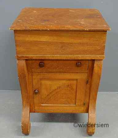 Appraisal: Grain painted Empire commode with a lift lid single drawer