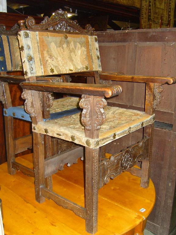 Appraisal: A pair of th century walnut elbow chairs possibly Spanish