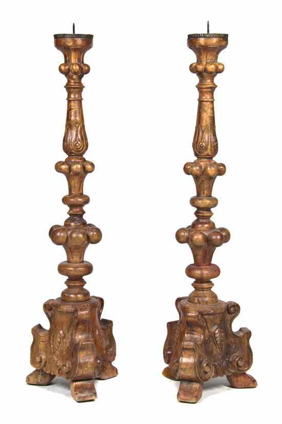 Appraisal: A Pair of Continental Carved Wood Pricket Sticks each of