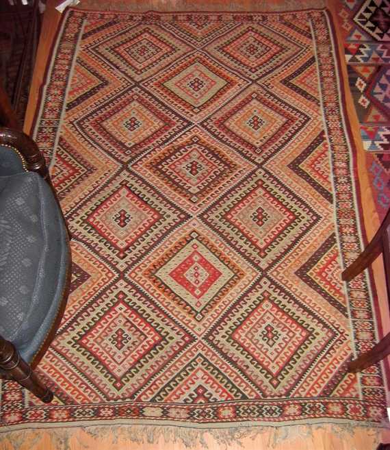 Appraisal: KURDISTAN KILIM old Central field divided into lozenges adorned with