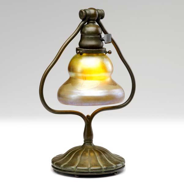 Appraisal: TIFFANY STUDIOS Desk lamp with pulled gold feather glass shade