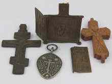 Appraisal: Russian religious items a carved wood crucifix a brass crucifix