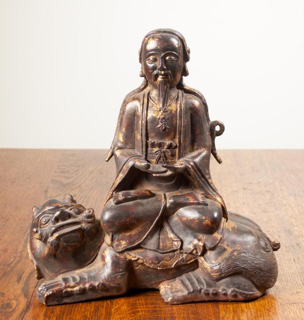 Appraisal: CHINESE GILT BRONZE SCULPTURE depicting a Taoist figure seated in