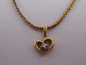 Appraisal: A carat gold diamond set heart pendant necklace approx cm