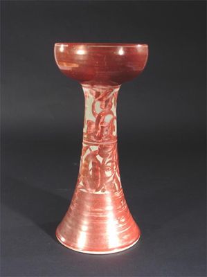 Appraisal: An Alan Caiger Smith Aldermaston Pottery candlestick painted in ruby