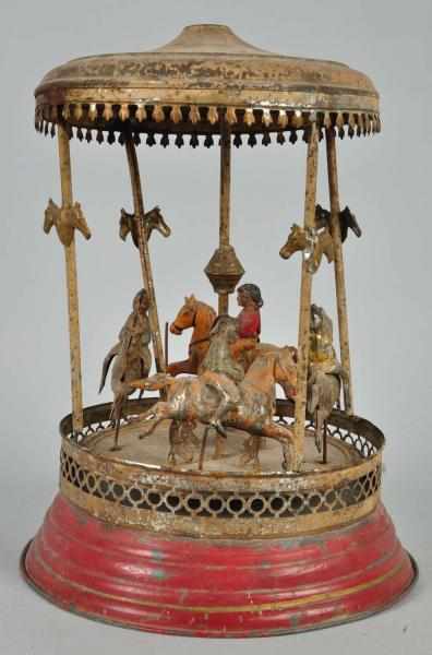 Appraisal: Tin Gunthermann Merry-Go-Round Clockwork Toy Description German Working Handpainted When