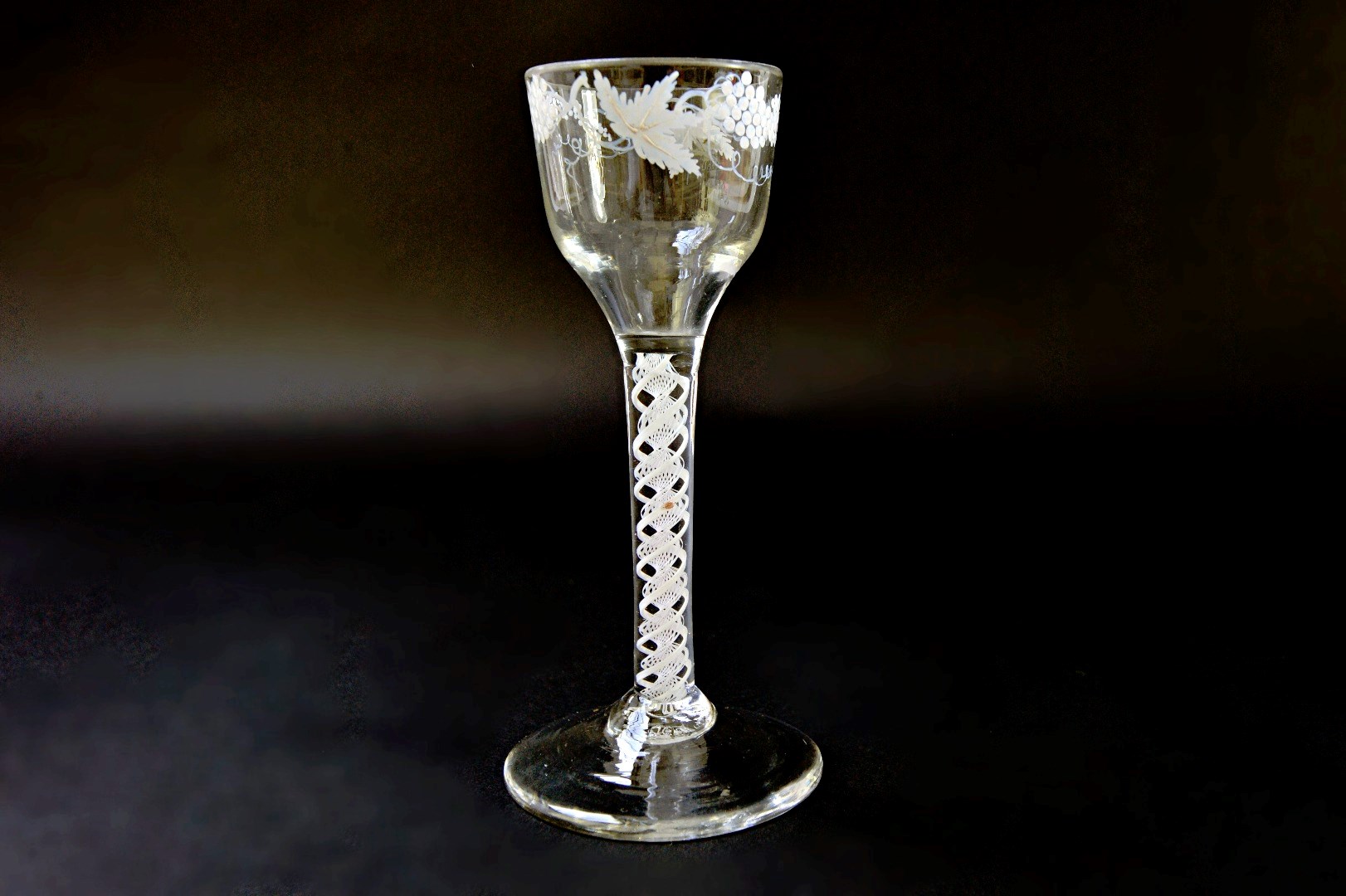 Appraisal: A Beilby enamelled opaque twist wine glass circa the ogee