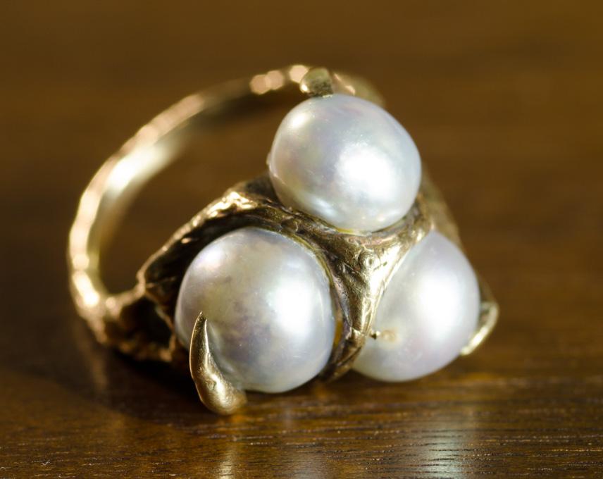 Appraisal: GREY PEARL AND TEN KARAT GOLD RING set with three