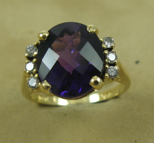 Appraisal: AMETHYST AND DIAMOND RING The k yellow setting centers an