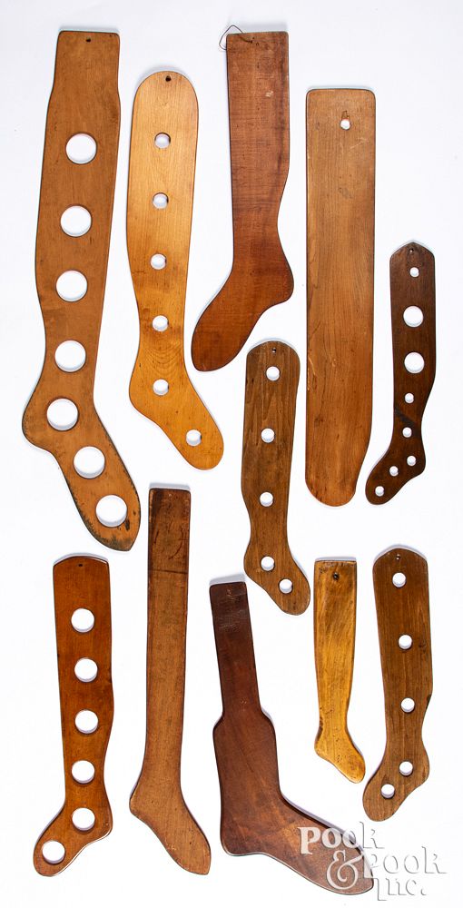 Appraisal: Ten wooden stocking stretchers largest - l Ten wooden stocking