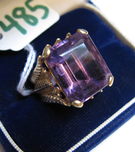 Appraisal: AMETHYST AND FOURTEEN KARAT GOLD SOLITAIRE RING centering a large