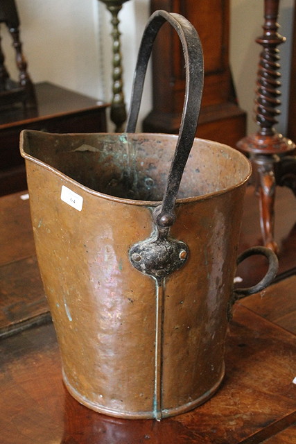 Appraisal: AN ARTS AND CRAFTS COPPER LOG BIN with iron handle