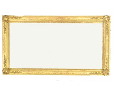 Appraisal: A giltwood and gesso rectangular wall mirror with etched foliate