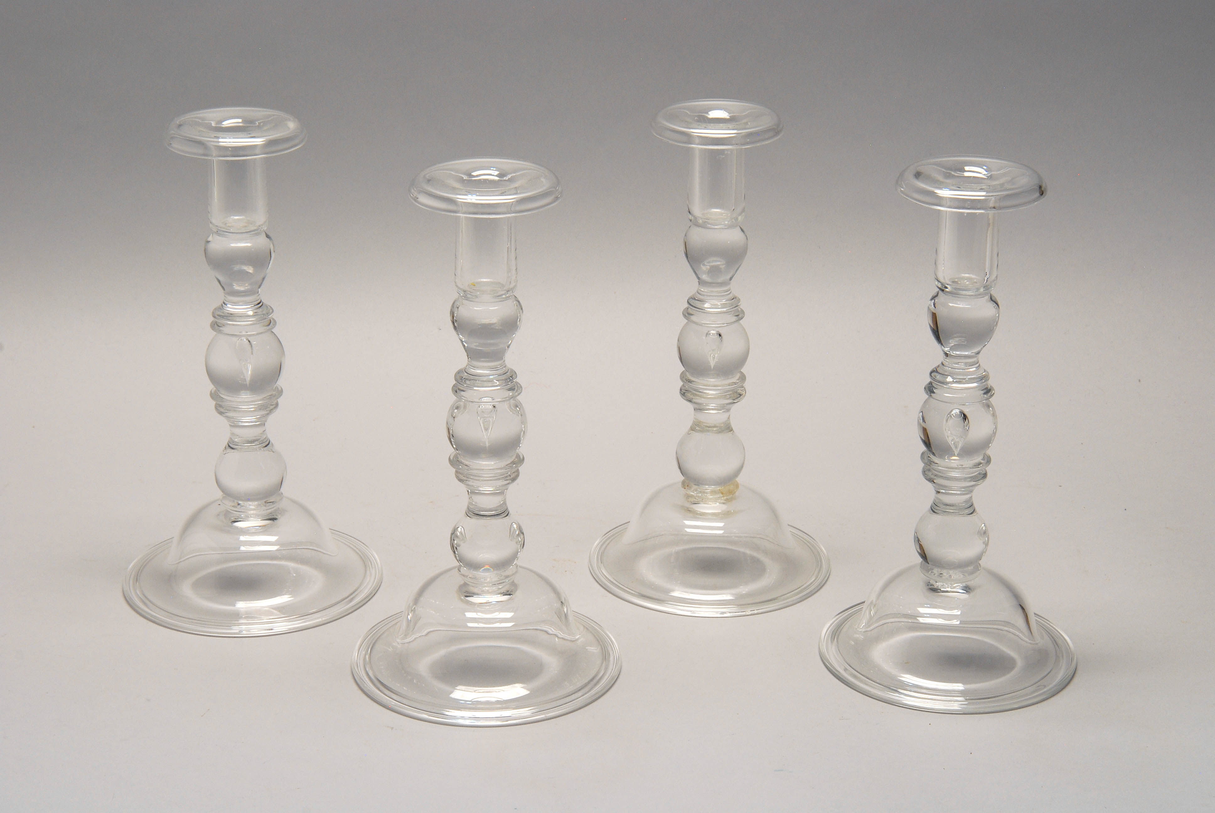 Appraisal: FOUR STEUBEN COLORLESS CRYSTAL CANDLESTICKS New York Mid- th CenturyEach