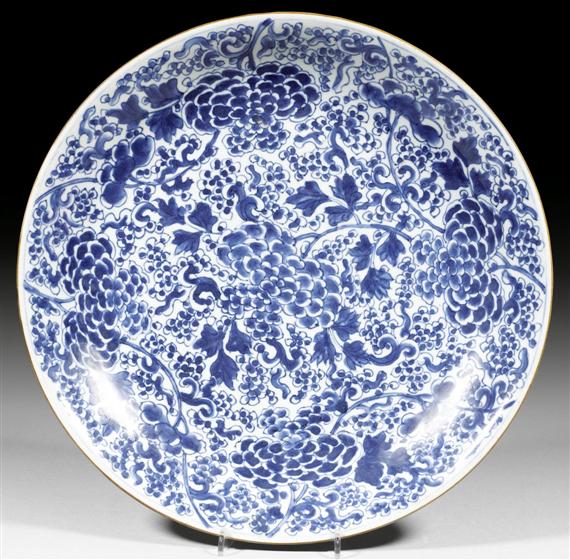 Appraisal: A LARGE BLUE-AND-WHITE CHARGER WITH FLORAL DESIGN China Kangxi period